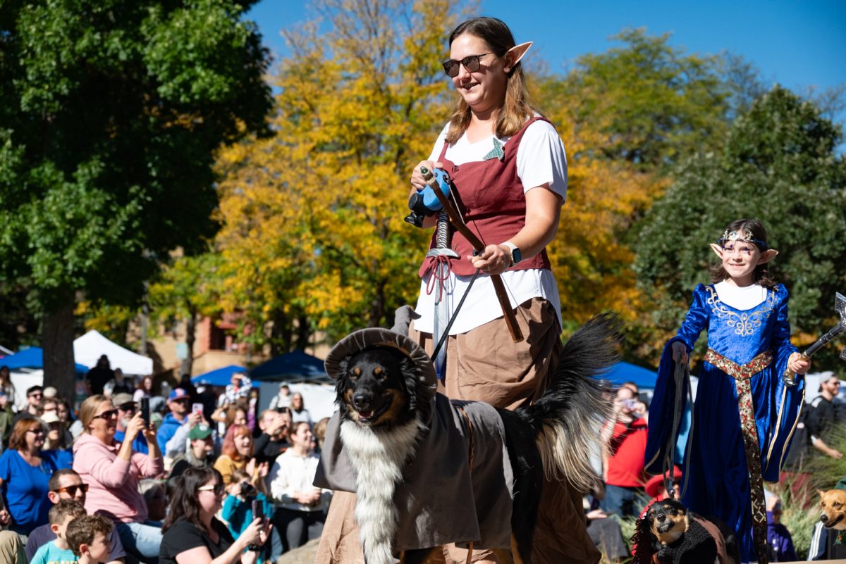 Though he might not be a corgi, this dog dressed as Gandalf leads a group of Lord of the Rings-themed contestants at the Tour de Corgi costume contest.