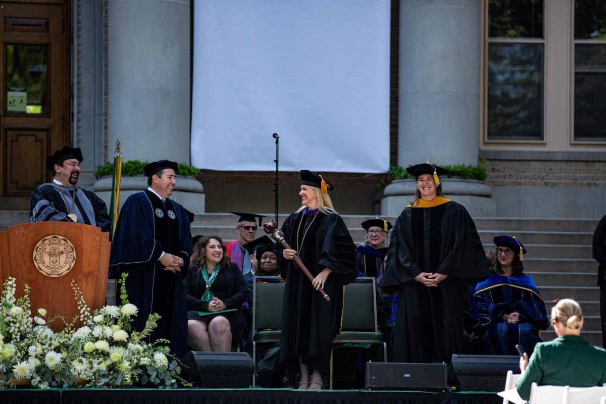 Colorado State University President Amy Parsons receives the mace and presidential medallion during her investiture Oct. 4. President Parsons becomes the 16th president of CSU.