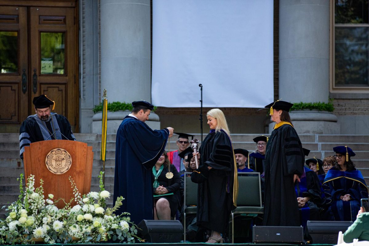 Newly invested President Amy Parsons receives the presidential medallion from Board of Governors Chair Armando Valdez during the Colorado State University fall address Oct. 4. The fall address marks the beginning of Amy Parsons time as president at CSU.