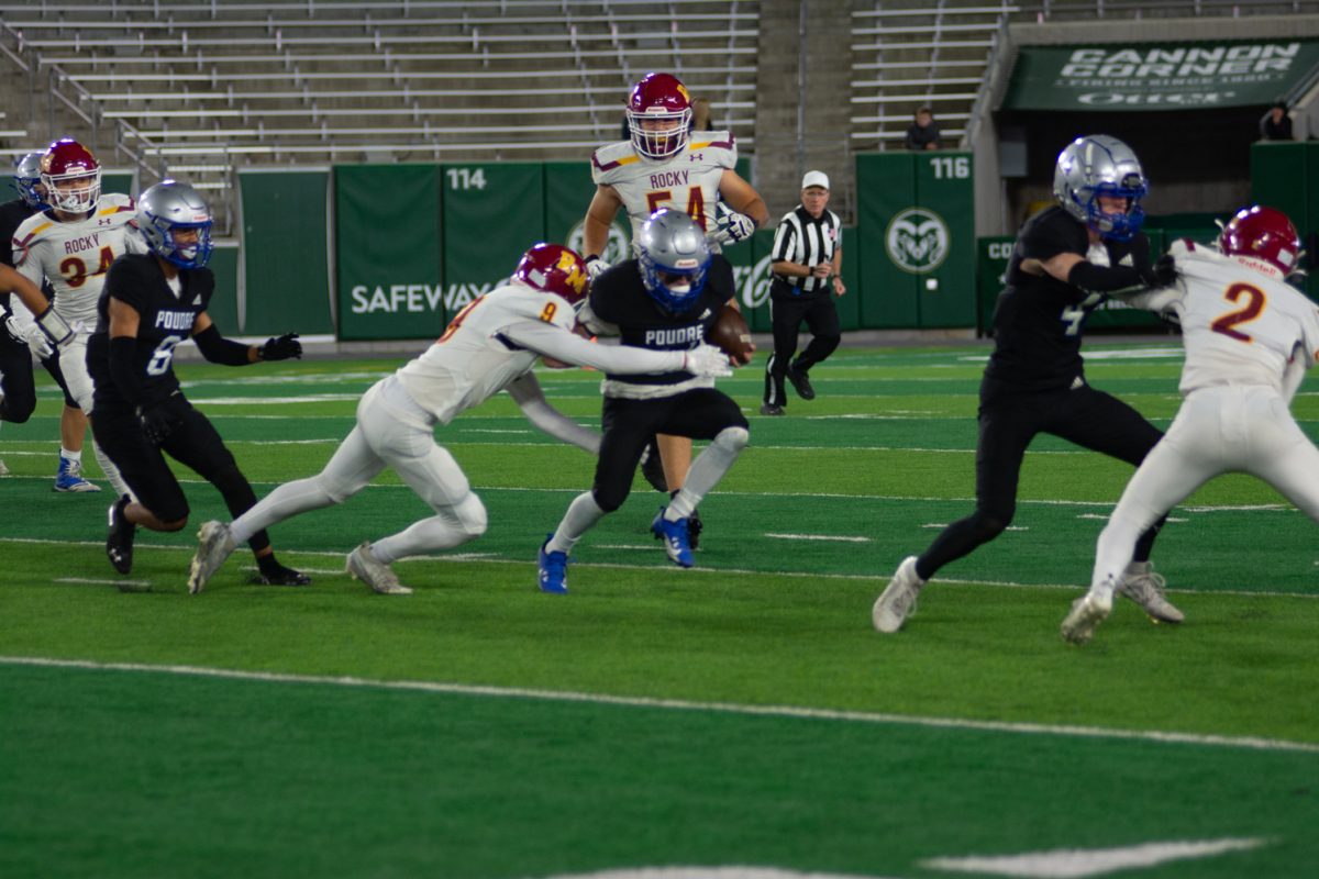  A Rocky Mountain player goes to tackle a Poudre player during the canvas classic on Oct. 6. Rocky Mountain won 26-0.