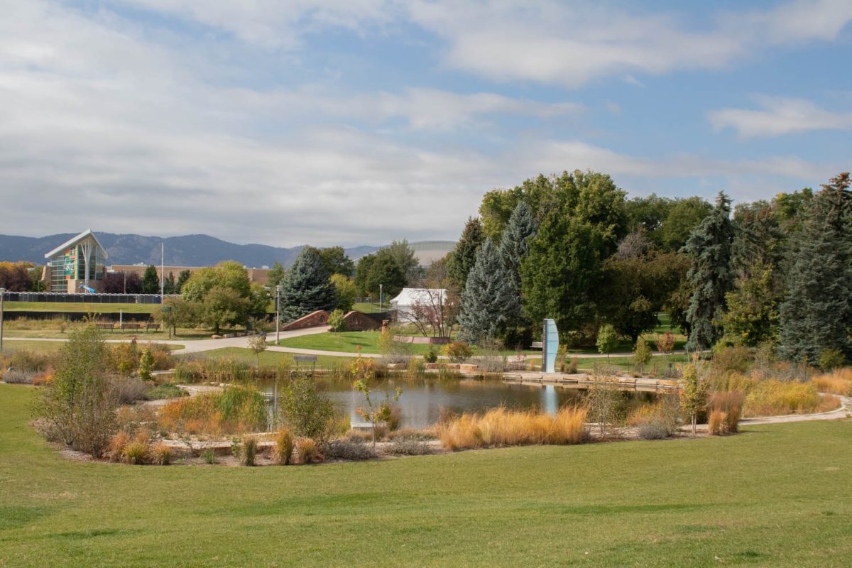 The lake outside the Lory Student Center sits calmly from the sidewalk near the LSC on October 6, 2023.