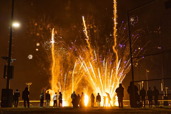 Colorado State University community members watch a fireworks show on the Intramural Fields during Friday Night Lights Oct. 13