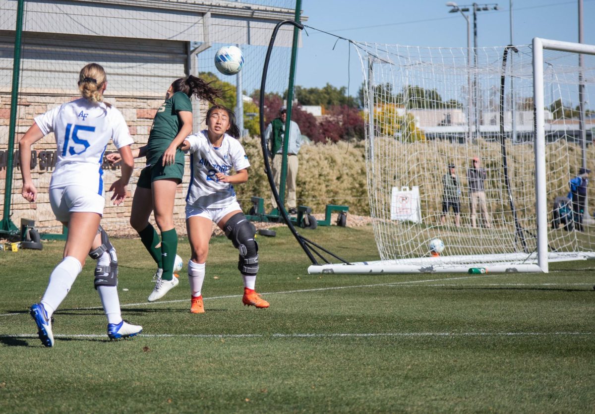 Sophia Coulombe (10) does a header over Air Force Academy player to cross the ball to her teammates to get a shot on goal on October 15.