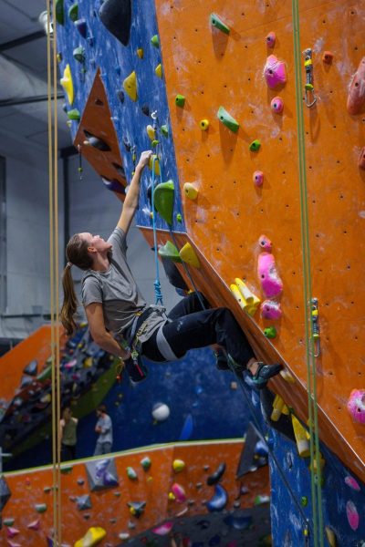 Avery Conn, Colorado State University climbing team president, climbs a route at Ascent Studios Oct. 23. I joined the team for the community; I stayed on the team for the community, Conn said. And my leadership is all about strengthening that connection.
