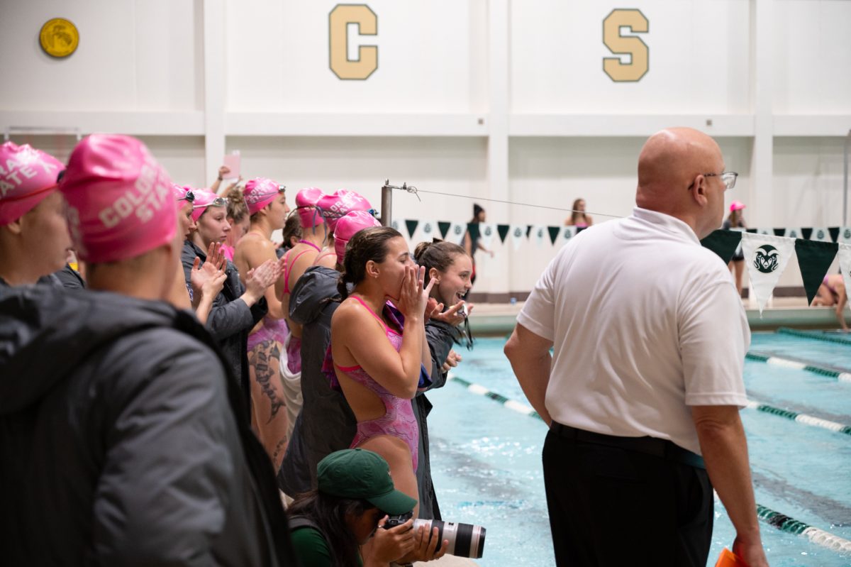 Colorado State University swimmers cheer on their teammates during their meet against Denver University at Moby Pool Oct. 27.