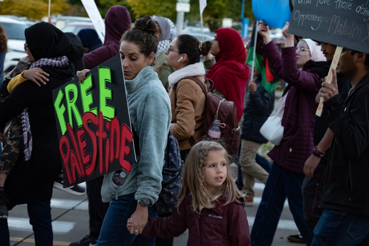 Ashleigh Jones and her daughter walk with a 'Freedom for Palestine Protest'.