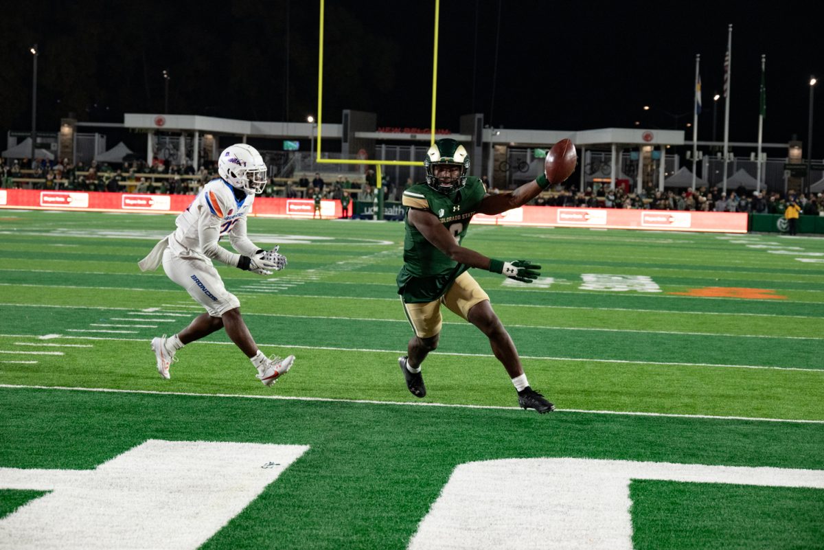 Colorado State University wide receiver Dylan Goffney (6) catches the ball and runs it into the endzone for a touchdown.