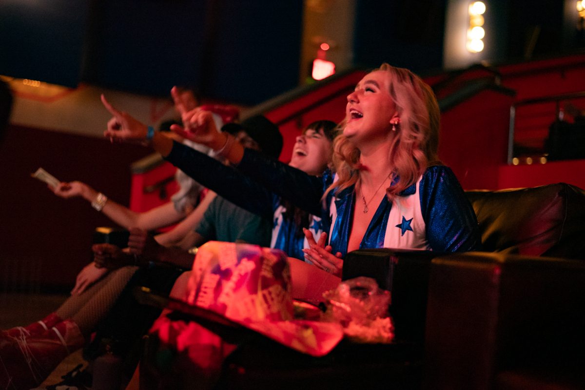 Hope Goughnour cheers on the performance with the rest of the audience at the Lyric.
