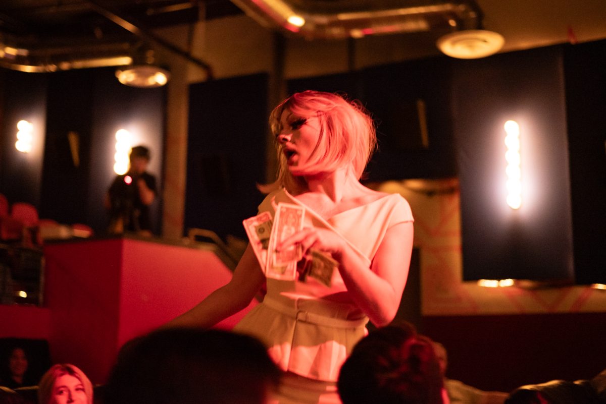 Miss Jewdy collects tips from the audience during her routine at the Lyric.