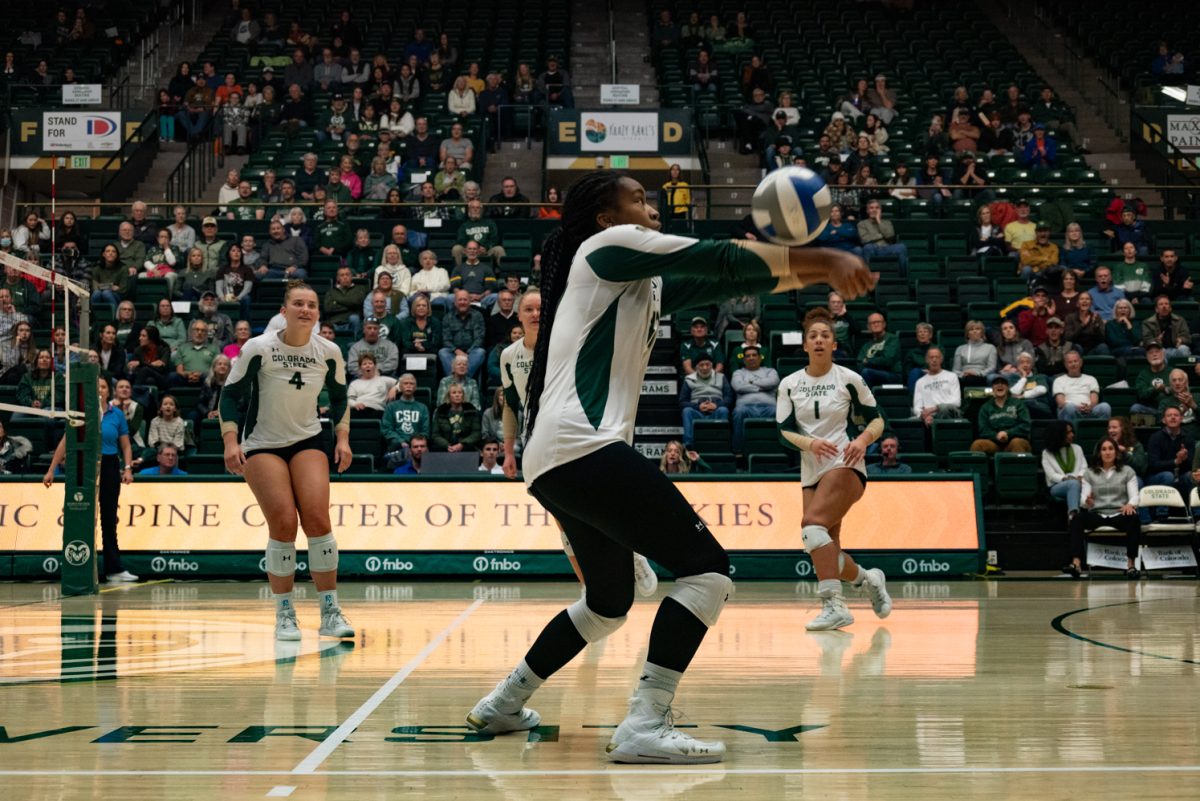 Colorado State University outside hitter Kennedy Stanford (17) passes the ball to her teammates.
