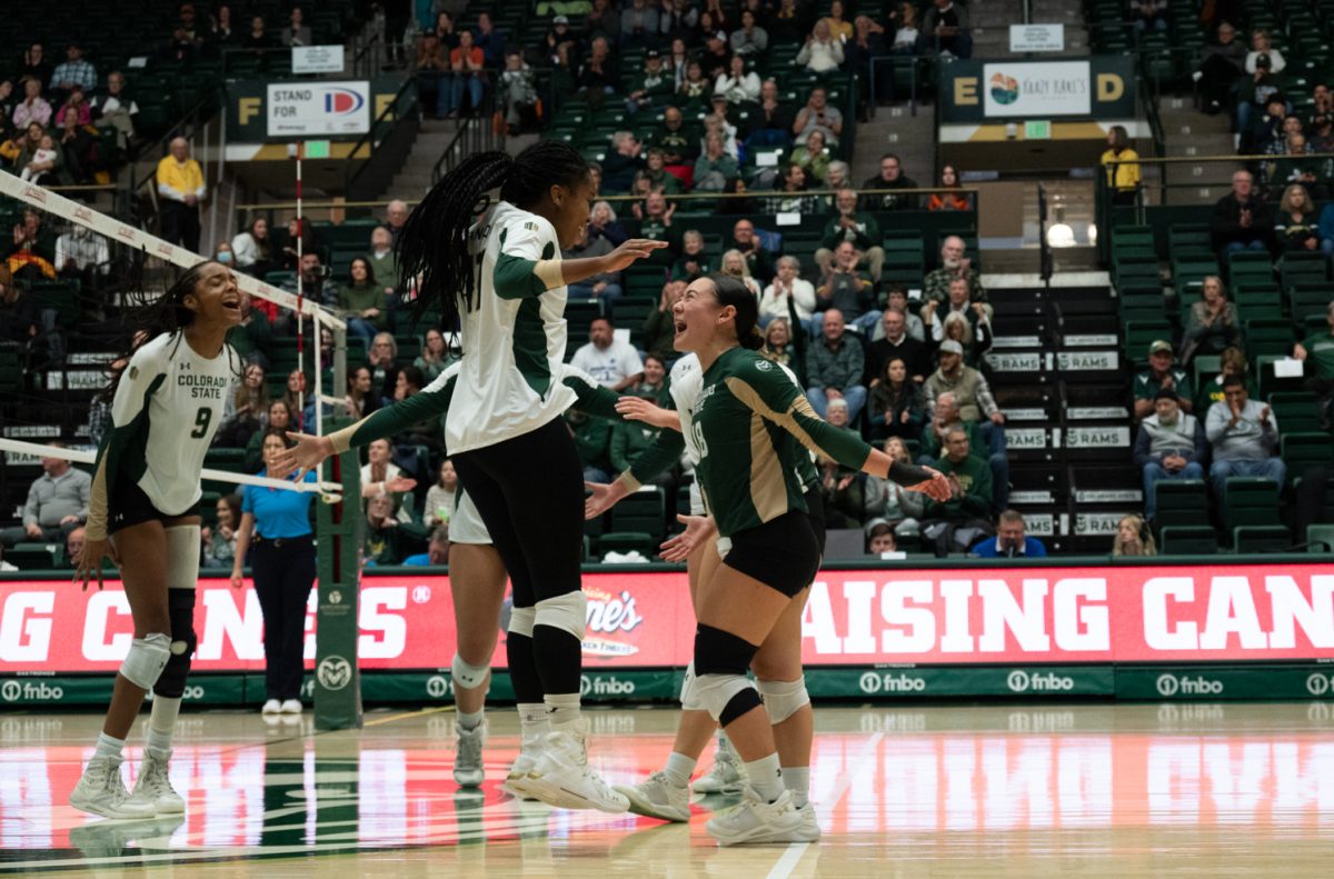 Senior Kennedy Stanford (17) and redshirt sophomore Kate Yoshimoto (18) celebrate after a sucessful play.
