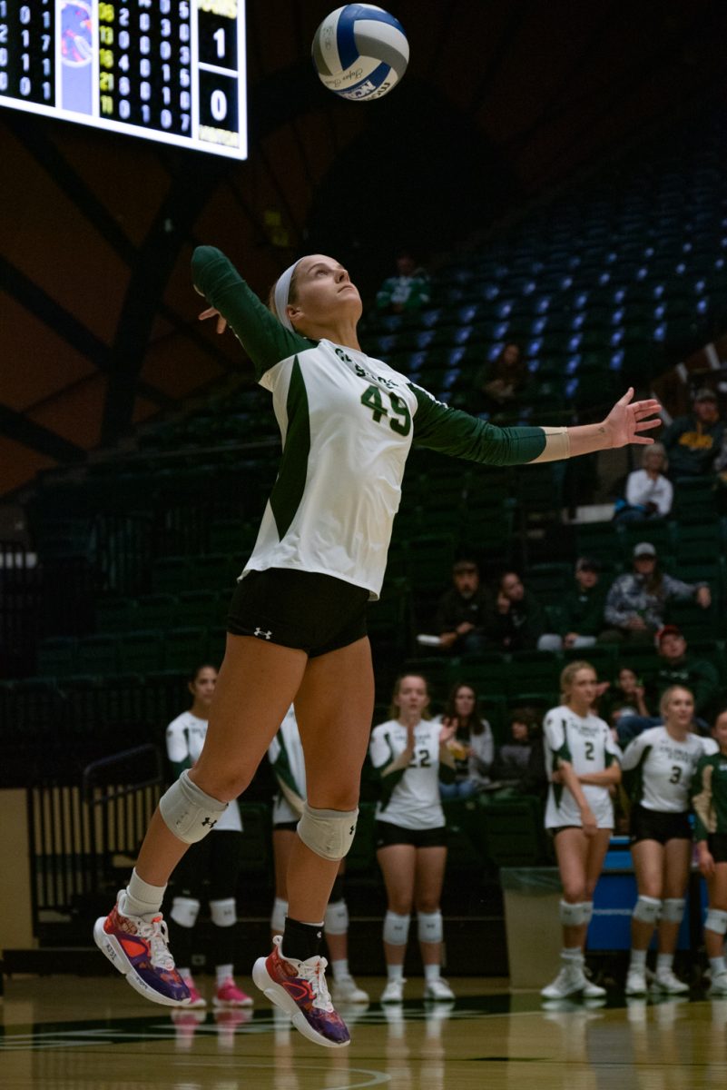 Colorado State University defensive specialist Ruby Kayser (49) serves the ball to Boise State.