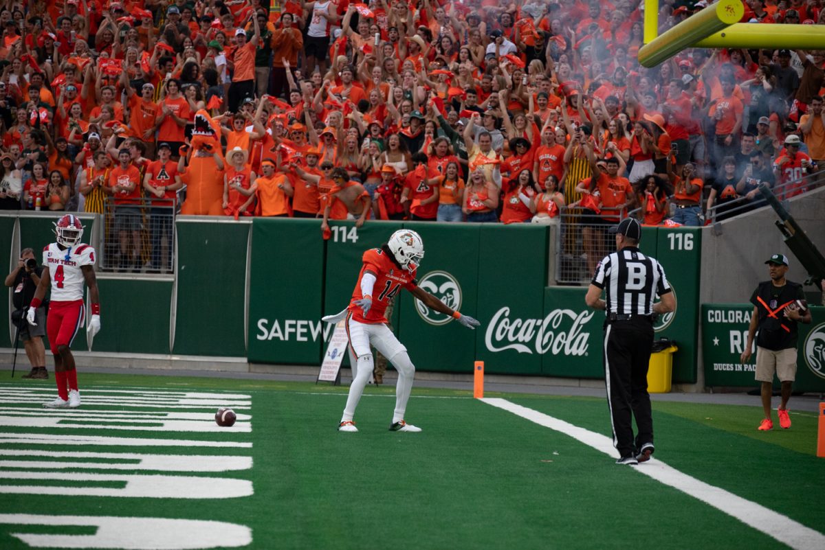 Colorado State University wide receiver Tory Horton (14) celebrates after scoring a touchdown.