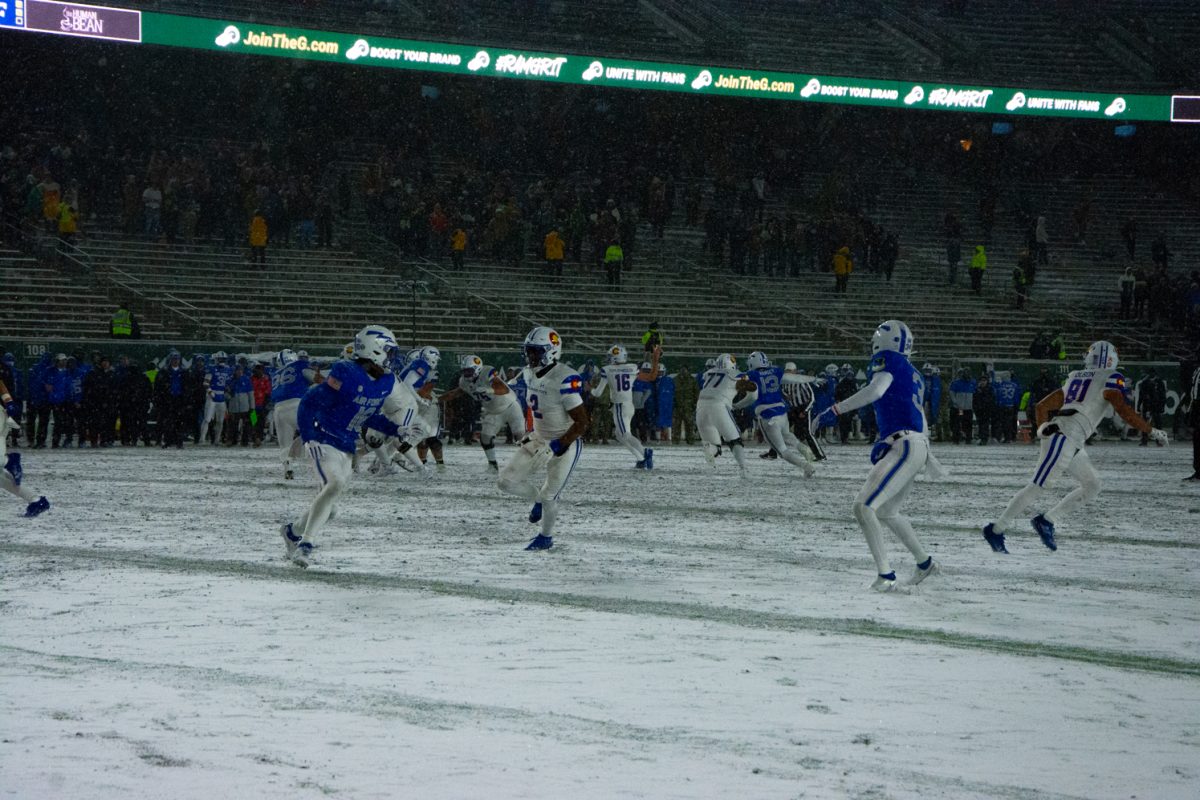 Both Colorado State University and the United States Air Force Academy power through the snow during the game Oct. 28. Air Force won 30-13.