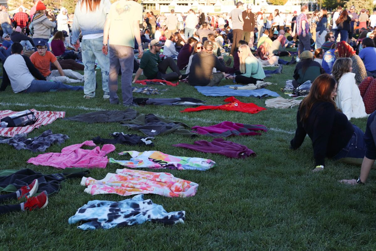 A family uses their children's jackets to reserve their places on the LSC lawn at the Goose concert Oct. 7. The band played on the LSC lawn with students, alumni, and fans in attendance. 
