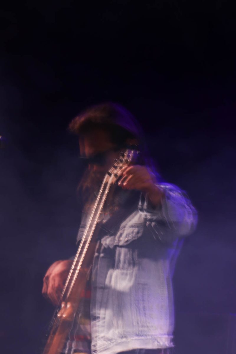 Trevor Weekz, bass player for Goose, tunes on stage Oct. 7. The band played on the LSC lawn with students, alumni, and fans in attendance. 