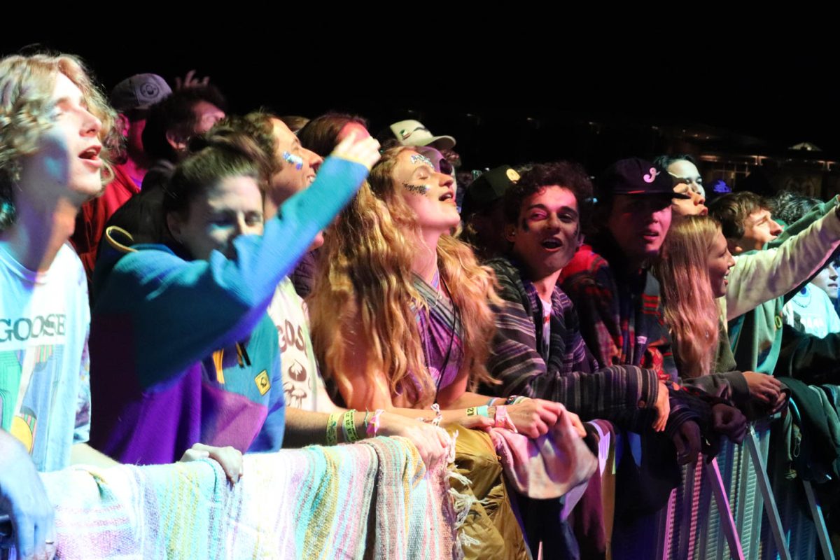 Front row concert goers dance as Goose plays on stage Oct. 7. In attendance were students, alumni, and fans. 