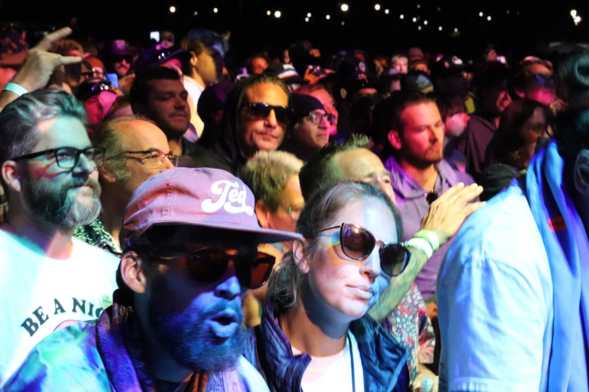 Front row concert goers dance as Goose plays on stage Oct. 7. In attendance were students, alumni, and fans. 