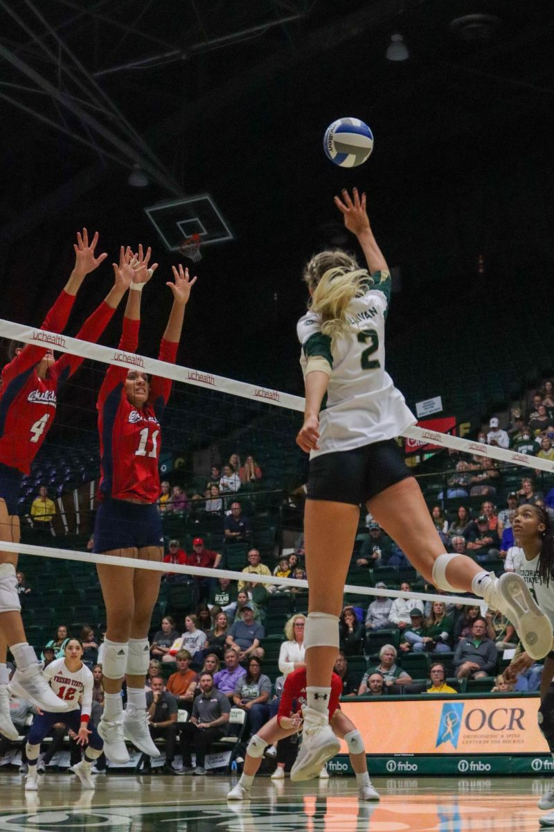 Colorado State University number 2, Annie Sullivan hits the ball over the net at the volleyball game against California State University Fresno. Fresno State won, 3-2. Oct. 19.
