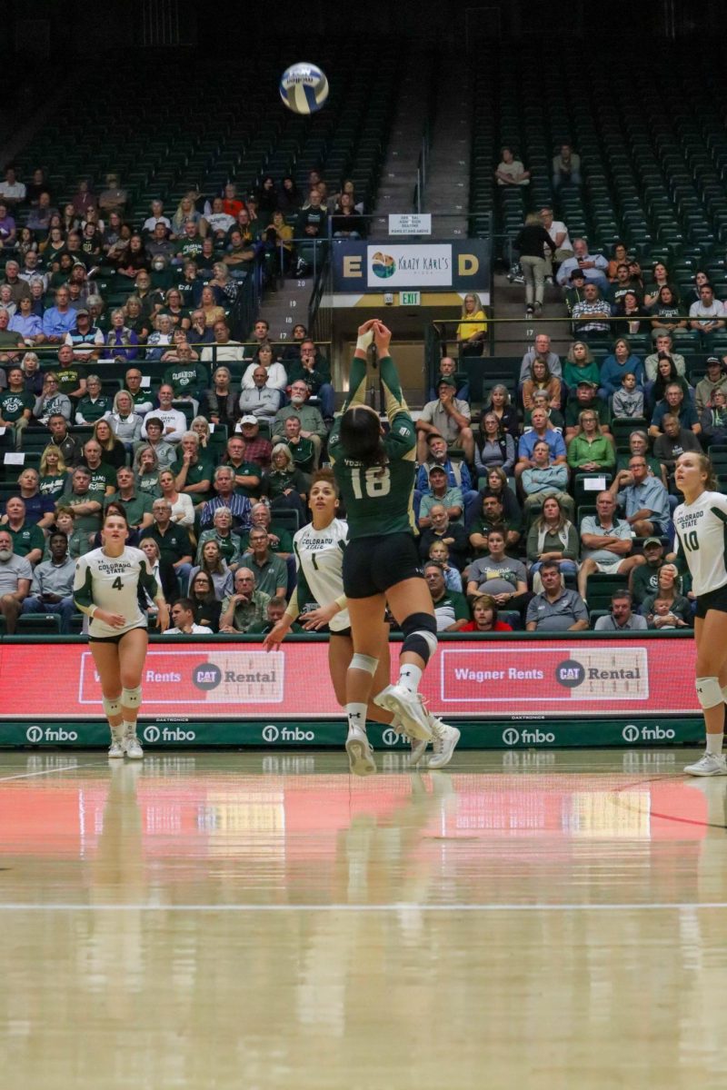 Colorado State University number 18, Kate Yoshimoto hits the ball at the volleyball game against California State University Fresno. Fresno State won, 3-2. Oct. 19.