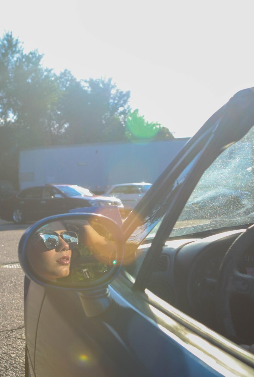 Mariah Sandoval poses in her blue Mazda Miata at Cars and Content hosted by Juice Sept. 17.