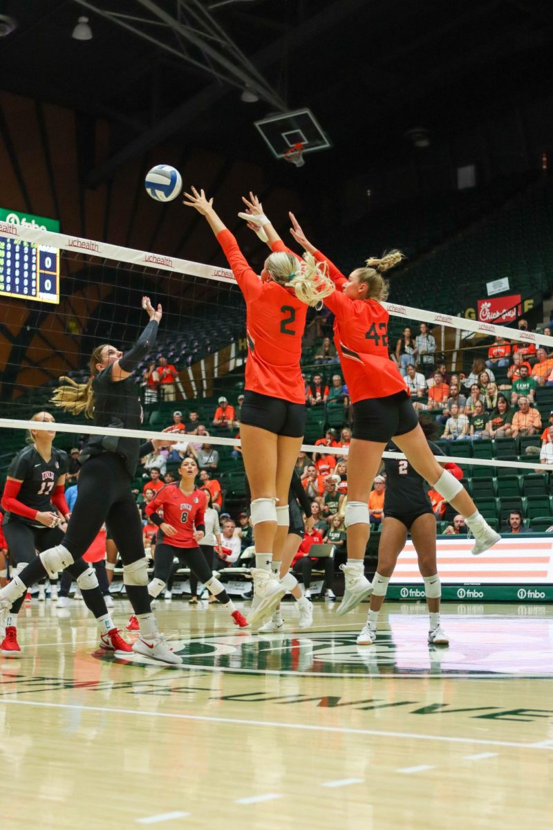 Colorado State University number 2, Annie Sullivan and number 42, Karina Leber go to block the ball coming from a University of Nevada, Las Vegas player. CSU won, 3-0. Sept. 30.