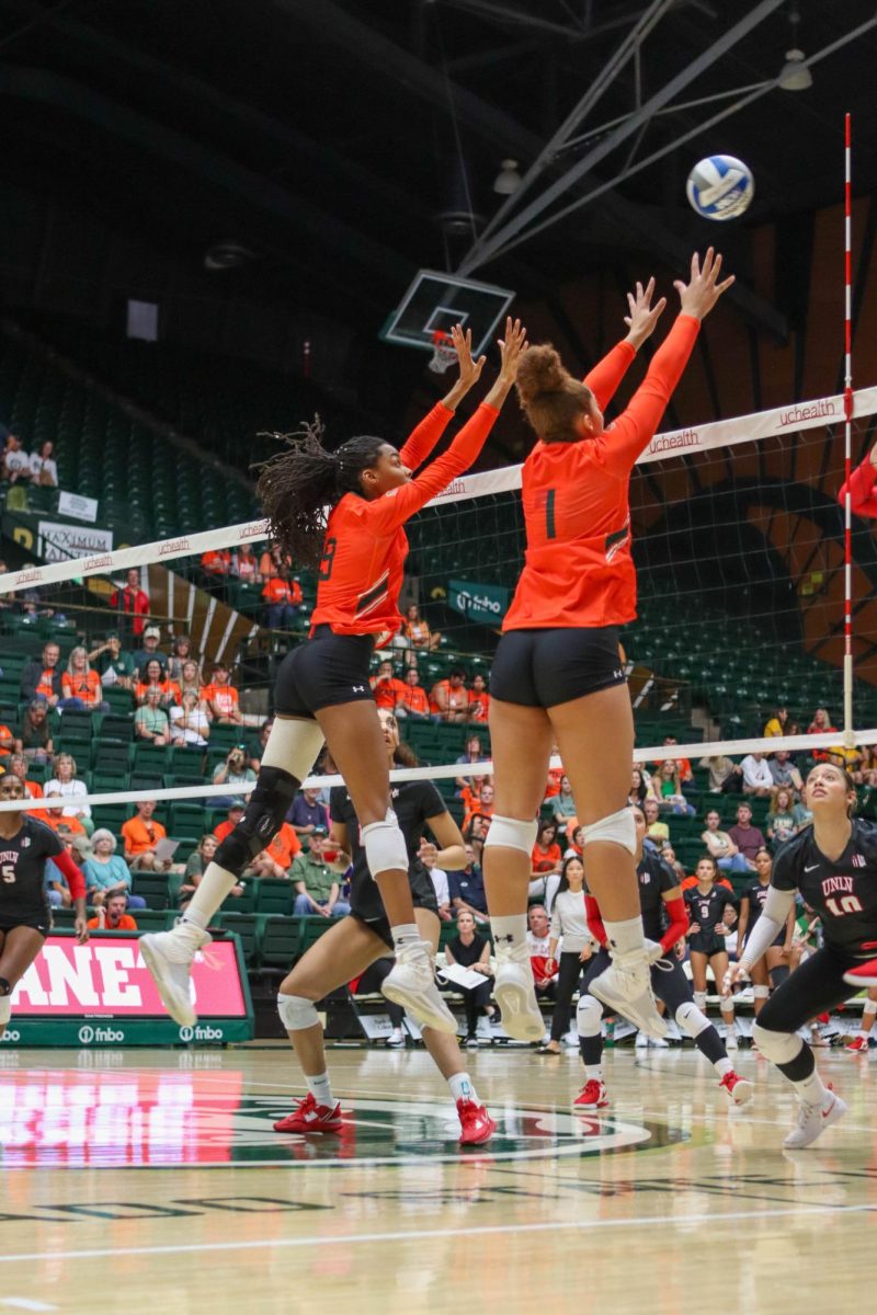 Colorado State University number 9, Naeemah Weathers and number 1, Malaya Jones block the ball from the University of Nevada, Las Vegas. CSU won, 3-0. Sept. 30.