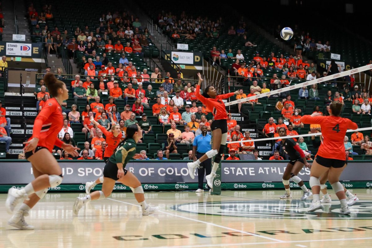 Colorado State University number 4, Emery Herman sets the ball to number 9, Naeemah Weathers in the game against the University of Nevada, Las Vegas. CSU won, 3-0. Sept. 30.