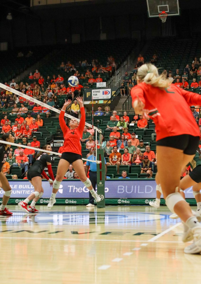 Colorado State University number 4, Emery Herman sets the ball to number 2, Annie Sullivan in hopes of scoring a point against the University of Nevada, Las Vegas. CSU won, 3-0. Sept. 30.