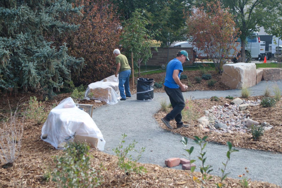 Colorado State University facilities management team work to add the finishing touches on the new Peace Corps tribute Garden located outside of the Lory Student Center, west of the theater. Oct. 2.