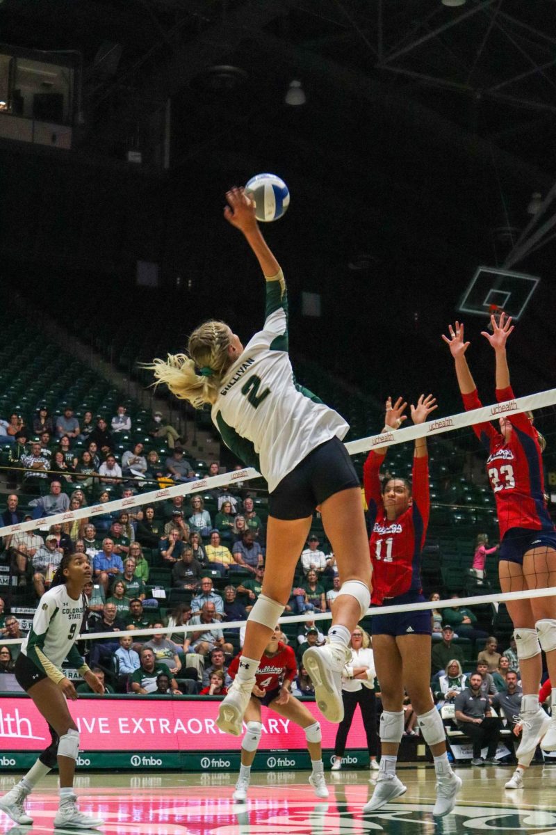 Colorado State University volleyball player Annie Sullivan (2) hits the ball over the net at the volleyball game against California State University, Fresno Oct. 19. Fresno State won 3-2.