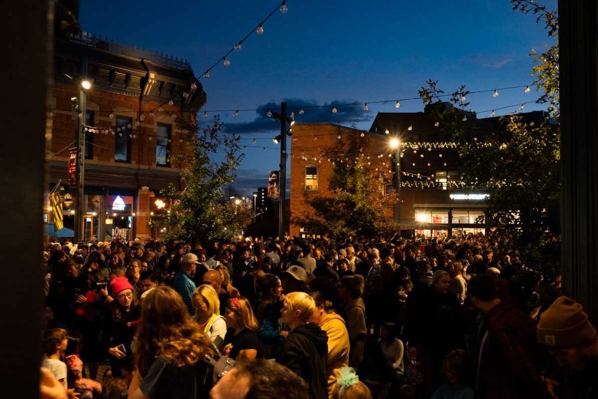 A crowd gathers in Old Town Square, Fort Collins to celebrate the city's annual Downtown Holiday Lighting Ceremony.