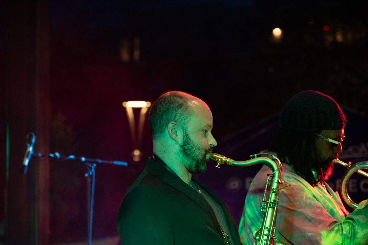 Soul Station continues their live music performance after the lights come on at the Downtown Holiday Lighting Ceremony in Old Town Square, Fort Collins.