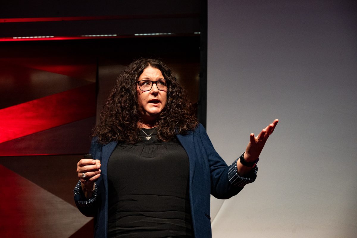 Dylan Demery, founder and owner of She’s Fly, a Colorado-based business that sells fly fishing equipment and classes for women, tells the story of losing her husband at the TedxCSU event.