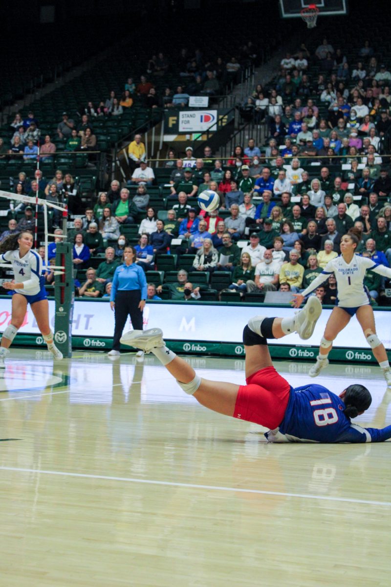 Colorado State defensive specialist Kate Yoshimoto (18) dives for the ball Nov. 16.