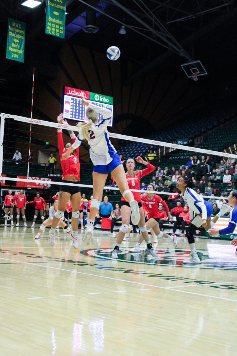 Annie Sullivan (2) spikes the ball to the University of New Mexico Lobos Nov. 16.