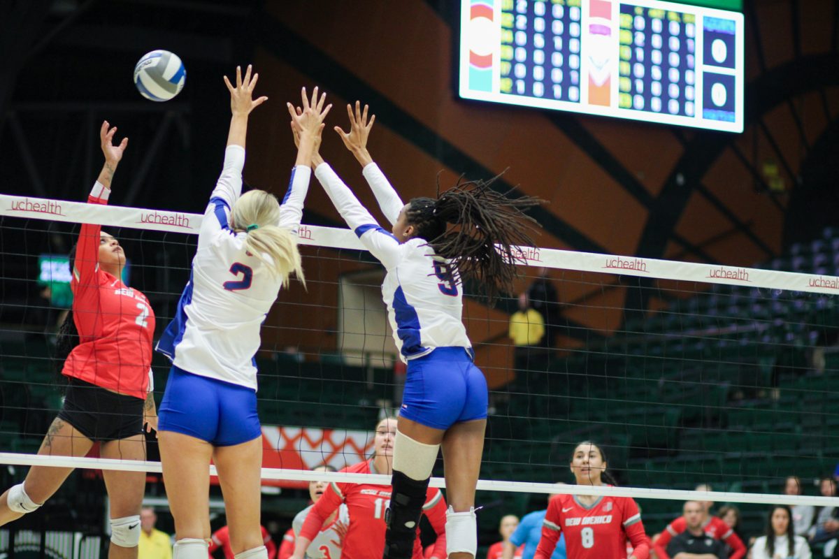 Colorado States Annie Sullivan (2) and Naeemah Weathers (9) block a spike from the University of New Mexico Nov. 16.