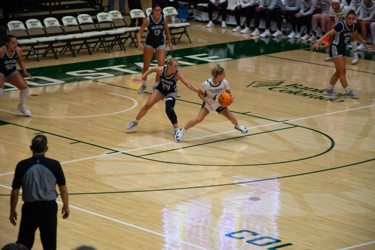 CSU #4 McKenna Hofschild blocks UNH #24 Kenzie Matulonis' reach during the CSU vs UNH basketball game on Nov. 15 (CSU won 67-45)