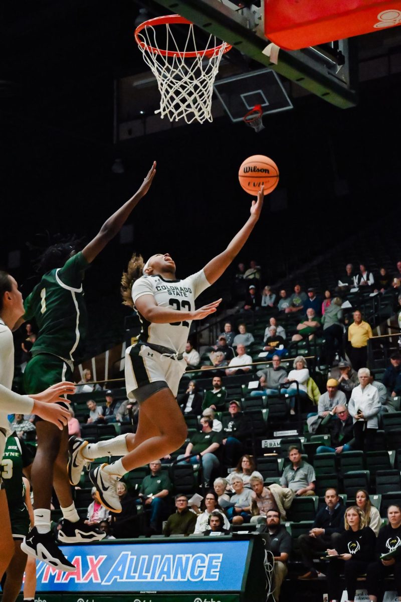 Cailyn Crocker (32) goes up for a layup and giving her 5 points in the season opener against Le Moyne. Moby Arena, Nov 6.