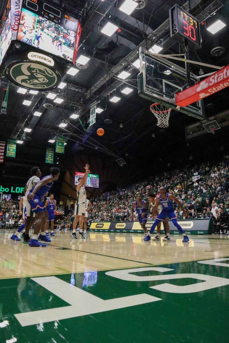 Colorado State University number 12, Patrick Cartier, shoots a free throw at the Men's basketball season opener against Louisiana Tech, CSU won 81-73.