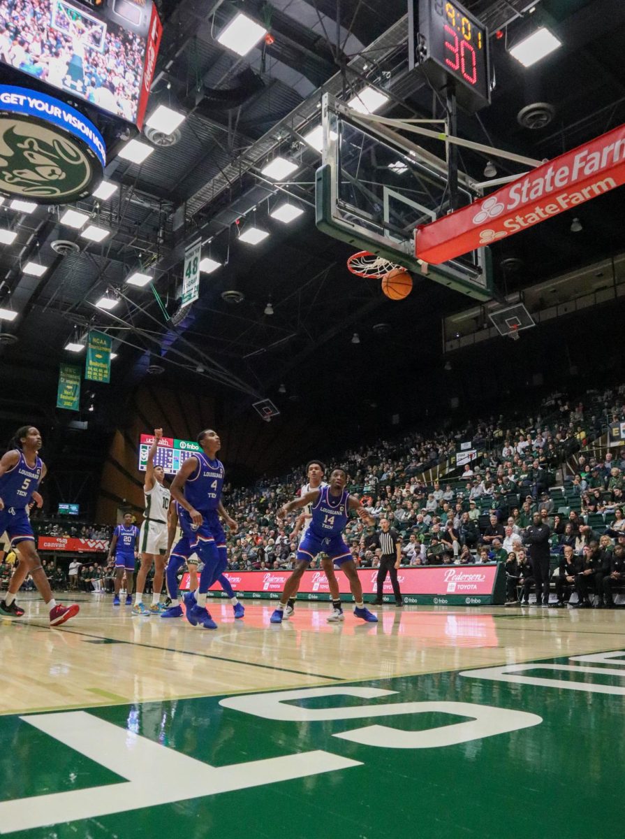 Colorado State University number 10, Nique Clifford, shoots a free throw at the Men's basketball season opener against Louisiana Tech, CSU won 81-73.