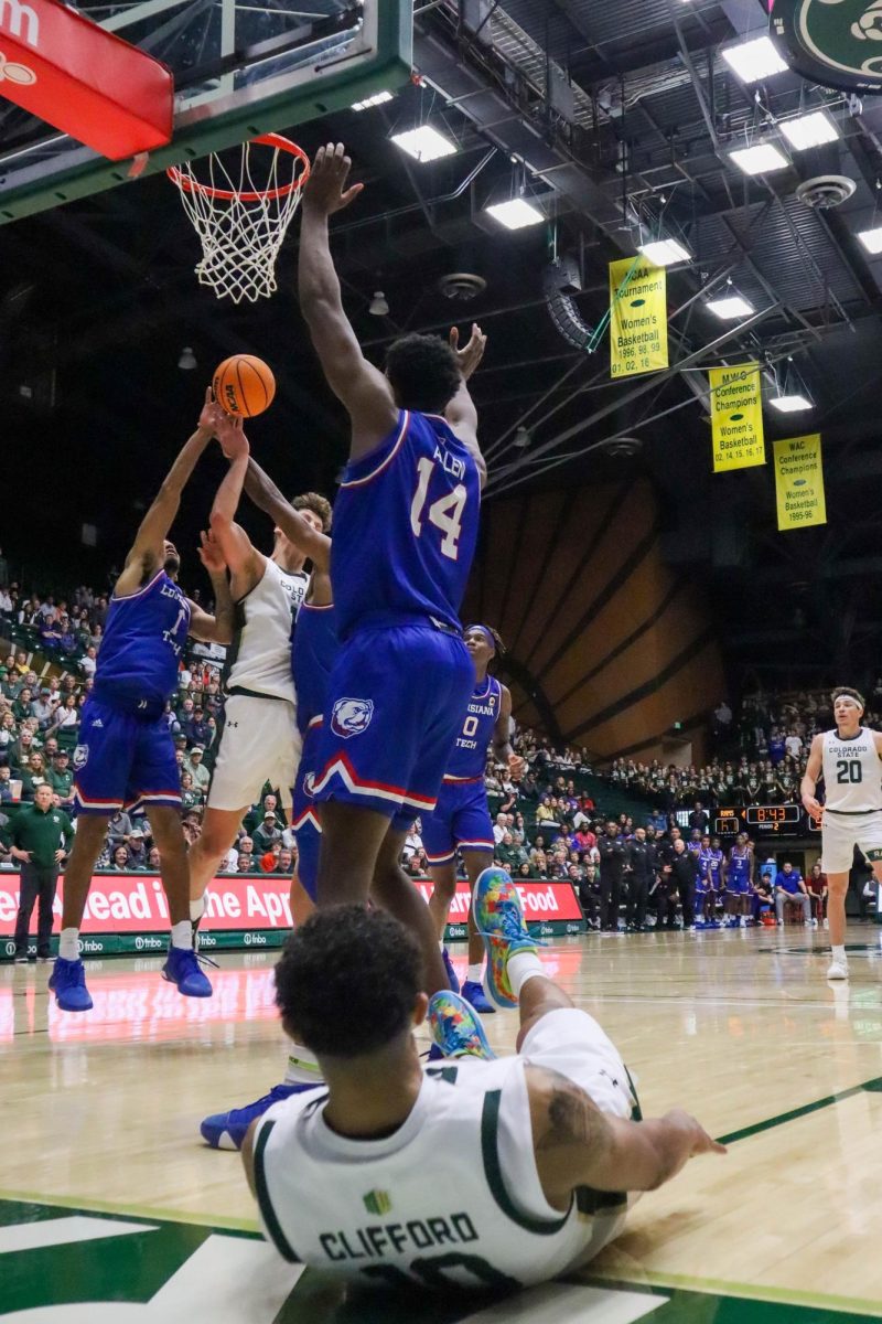 Colorado State University number 12, Patrick Cartier, fights for the rebound at the Men's basketball season opener against Louisiana Tech, CSU won 81-73.