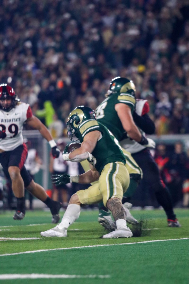 Colorado State University No.28 Vann Schield runs the ball down the field at the military appreciation game against San Diego State University, CSU won 22-19.