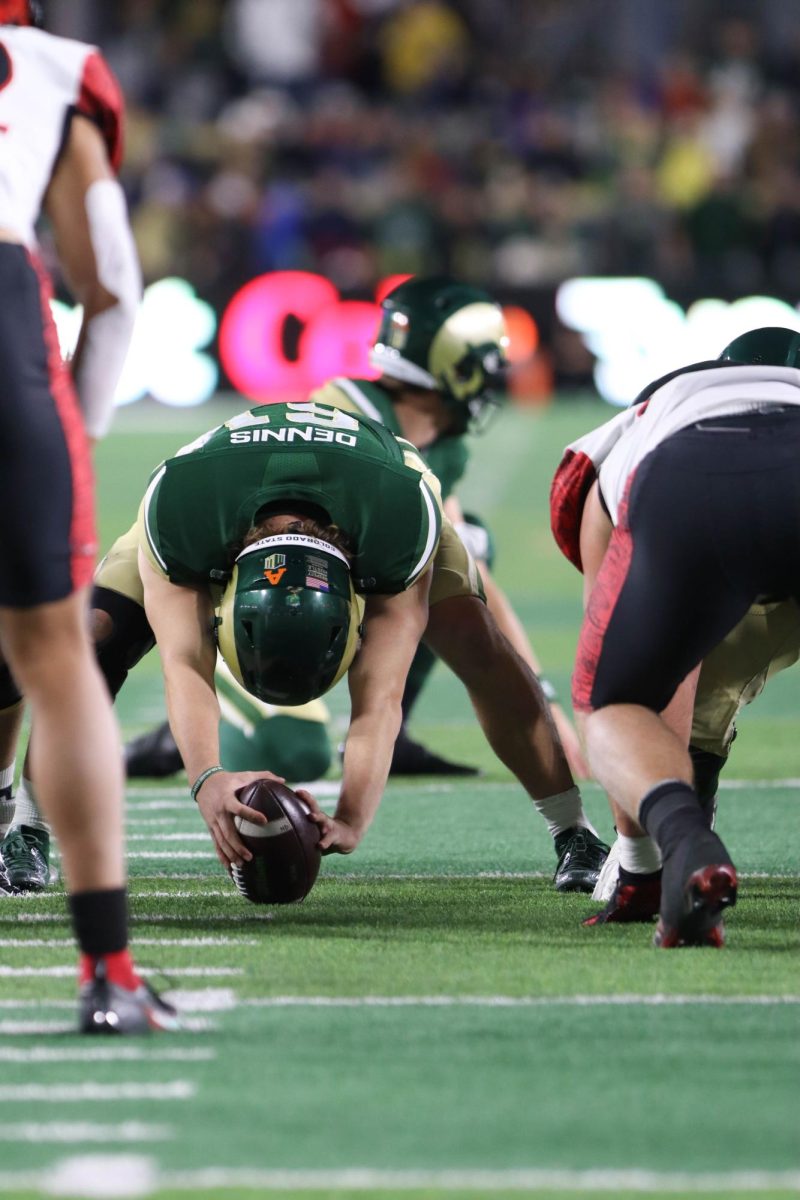 Colorado State University N.61, Jake Dennis prepares to snap the ball to the holder at the military appreciation game against San Diego State University, CSU won 22-19.