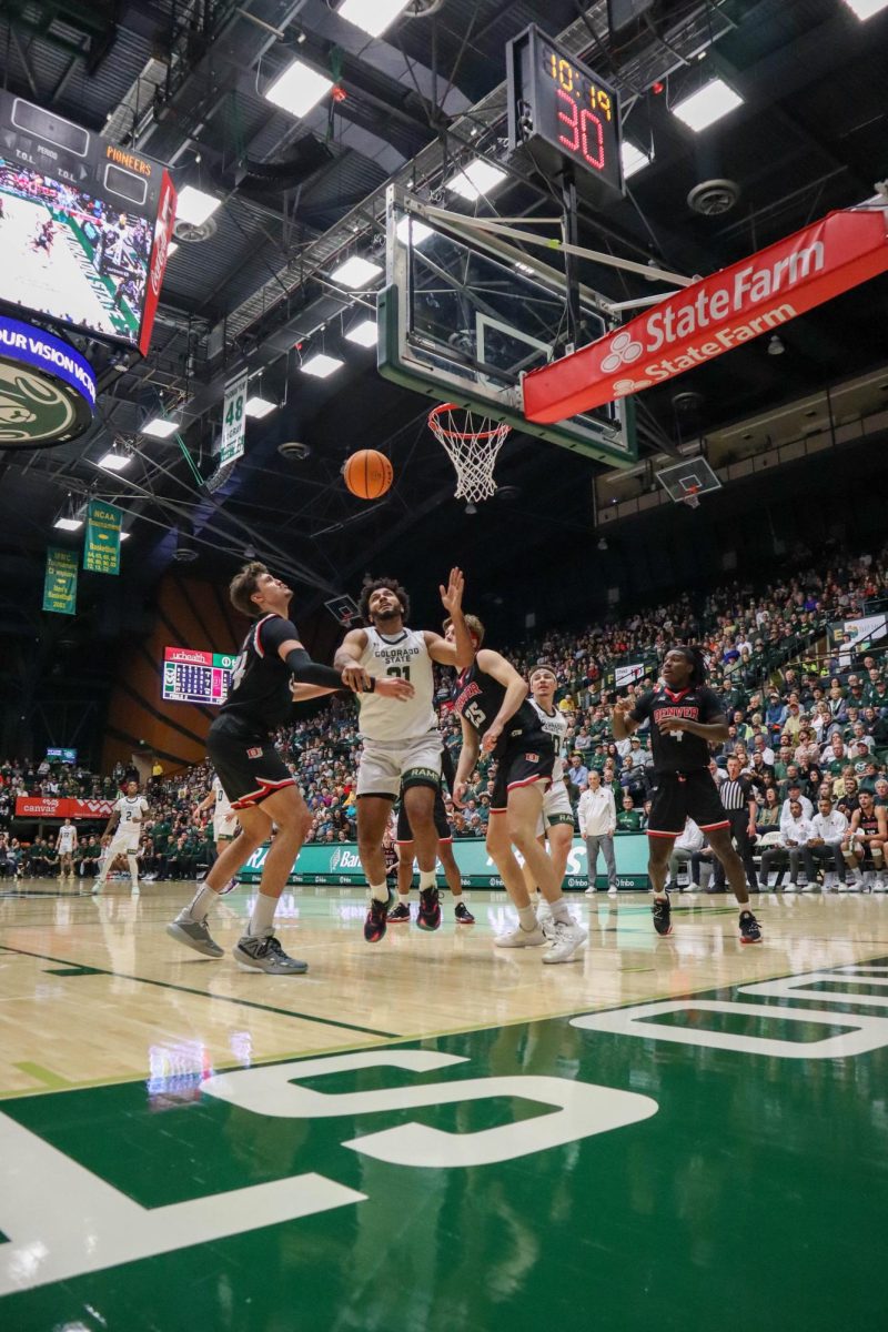 No. 21, Rashaan Mbemba goes to shoot the ball at the men's basketball game against Denver University, CSU won, 90-80.
