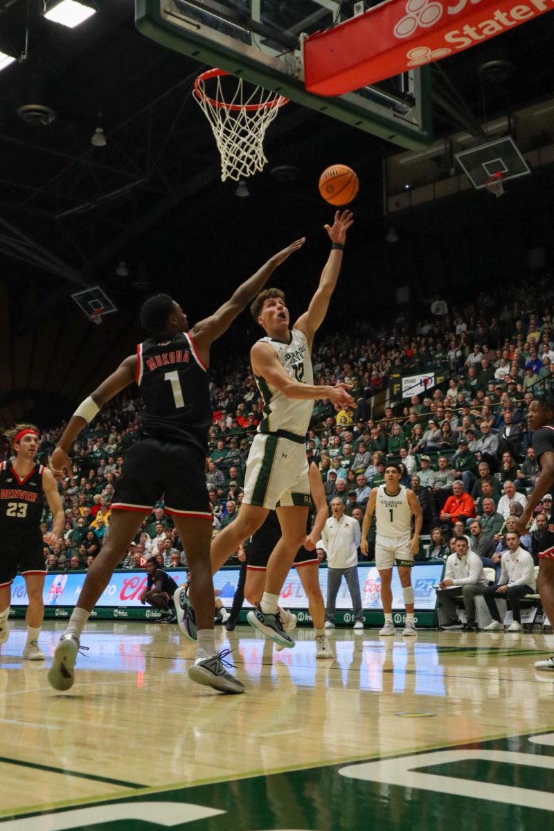 No. 12, Patrick Cartier shoots the ball at the men's basketball game against Denver University, CSU won, 90-80.
