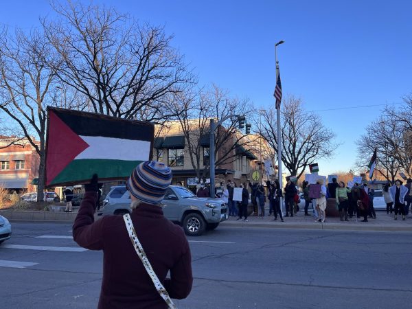 As cars pass by the intersection of Oak Street and College Avenue, March for Palestine protesters chant, From the river to the sea, Palestine will be free Dec. 30. 