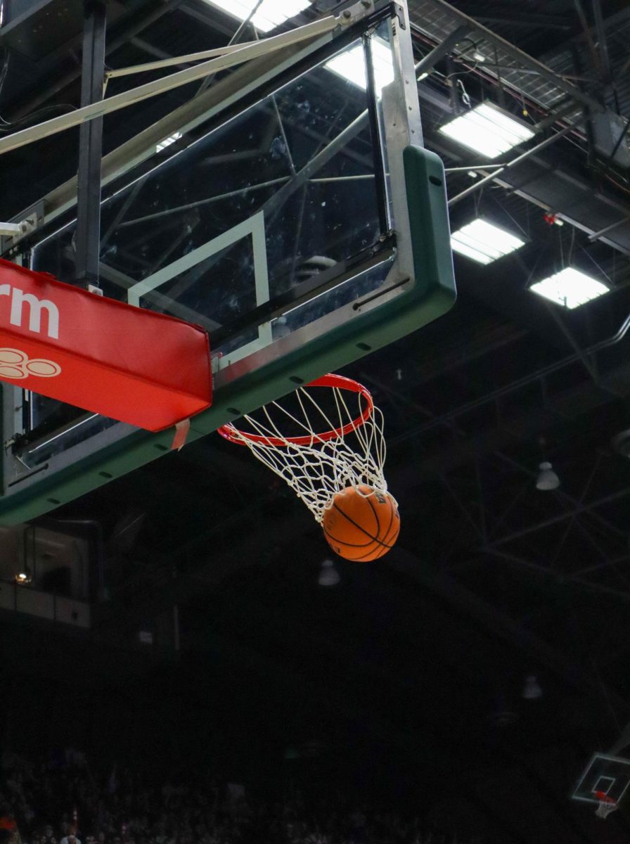 Colorado State University makes a basket at the men's basketball game against Denver University, CSU won, 90-80.