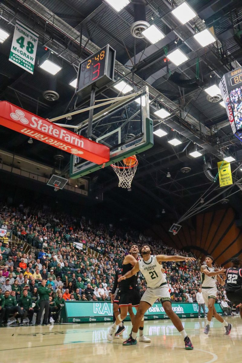 No. 21, Rashaan Mbemba watches the ball go through the hoop, scoring points for CSU at the men's basketball game against Denver University, CSU won, 90-80.