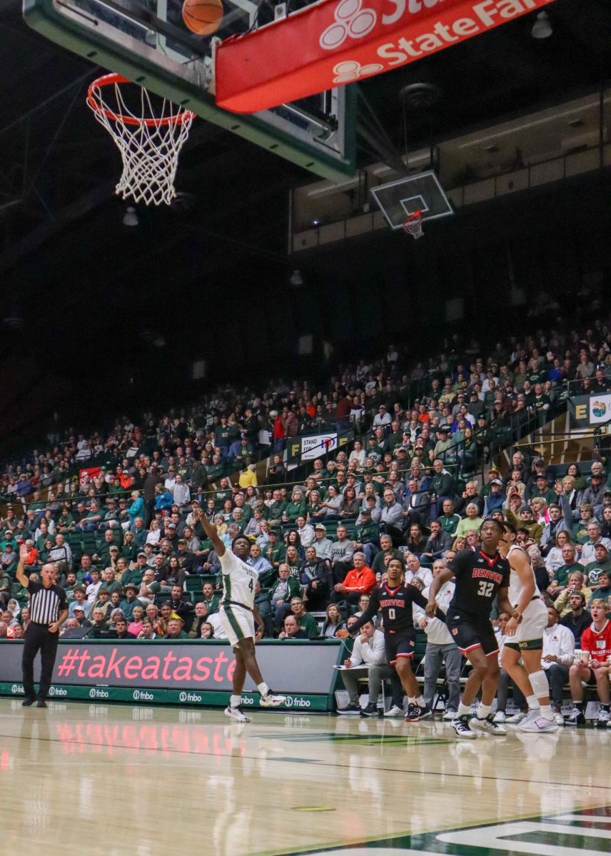 No.4 Isaiah Stevens shoots a three-pointer at the men's basketball game against Denver University, CSU won, 90-80.
